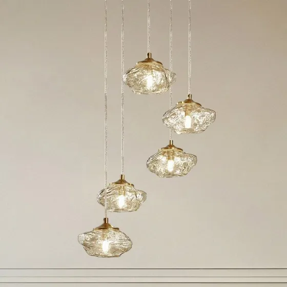 Lindby Piatra Pendelleuchte 5-flammig Amber/Messing Ø45cm