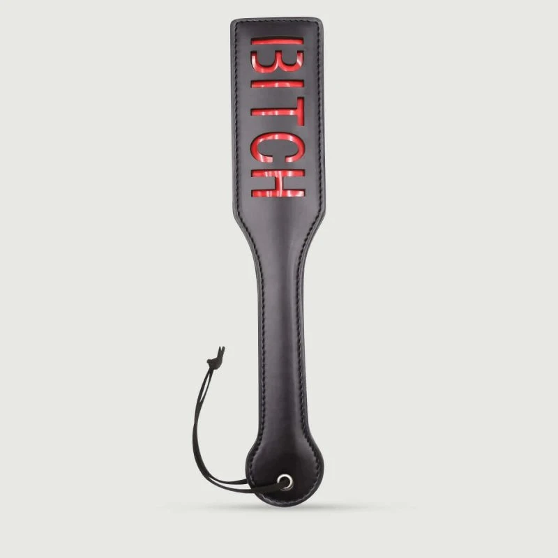 Domme Serie Leder Paddel mit BITCH Ausschnitt - Schwarz